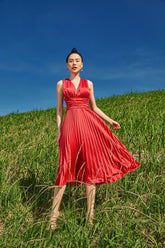 Silk pleated midi dress with sleeveless wrap bodice and flowing A-line silhouette